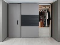 Sliding module with a set of drawers, shelf and clothes rail 