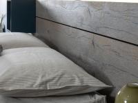 Close up of the headboard made of wooden panels