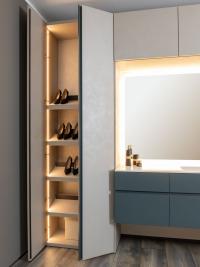 View of the inside of a Pacific column cupboard with internal LED lighting and shoe rack