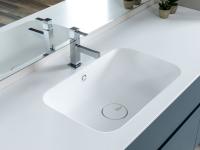 Close up of the built-in washbasin with overflow hle and chromed clic-clac drain - colour rendering with lights turned off