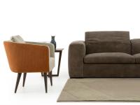 Rubina modern lounge armchair with high wooden feet