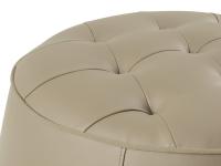 Detail of the sand faux leather ottoman with matching piping