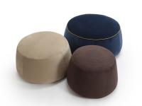 Set of three round footstools covered in three different fabrics