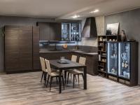 Corner modern kitchen with display case with two doors, wall units with glass doors and internal led lights