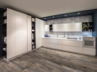 Matt white kitchen without handles, L-shaped with columns, top with integrated sink, glass hob and vasistas wall units