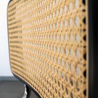 Close up of the Cesca B32 Chair by Marcel Breuer - seat with black lacquered beechwood edge and rattan seat 