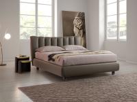 Amanda upholstered and leather-covered bed with curved shell headboard
