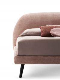 Detail of the round headboard matched with the thin h.10 cm bed frame: mod.A tilted feet