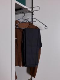 Detail of movable shelf and pull-out trouser rack