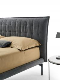 Details of the Felipe bed with a super slim 5 cm high bed frame, and high tubular metal feet (mod. T)