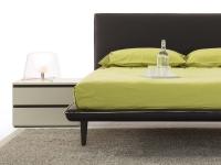 Pinch upholstered bed with high feet and slim bed frame