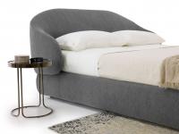 Kalin bed matched with Cora coffee table used as a bedside table