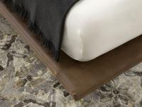 Detail of the thin bed-frame in Tivano leather