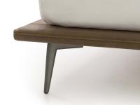 Detail of the high burnished metal foot matched with the slim bed frame in Tivano leather