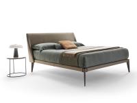 Nobel upholstered leather bed with exposed burnished metal frame
