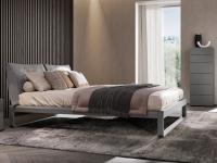 Virgo bed with rounded bed frame and headboard with cushions
