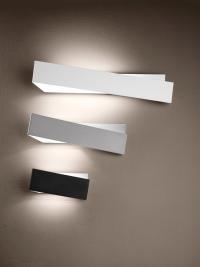 Close-up of the three available sizes of the wall light - in white, black and anodised aluminium