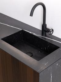 Detail of the wash-basin integrated inside the Marquinia Black marble top
