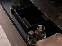 Detail of the inside of the drawer with shaped cut for the passage of the siphon