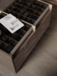 Central island for Izar Lounge walk-in wardrobe - detail of glass top with storage trays