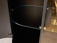 Detail of the inner compartment of the curved side door with rounded glass shelves