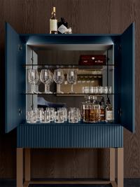 Interior view of the bar cabinet with smoked glass shelves, mirrored back and interior LED bars