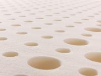 Close up of the natural, hypoallergenic latex top that gives the mattress a calibrated bearing capacity