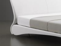 Close up of the shaped headboard and bed frame connection