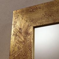 Away in a gold leaf finish on red lacquer base