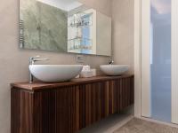 Wall-hung wooden bathroom cabinet with two countertop washbasins.