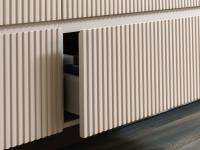 Close-up of the slatted MDF fronts with a 45° cut of the top edge. Notice the smooth horizontal trim edge in matching colour