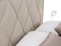 Detail of the Olivier bed's rhombus-quilted headboard