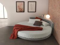 Wheel round bed covered in grey fabric