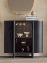 Dafne buffet cabinet made from curved wood, with a central glass door