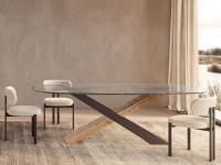 Haynes oval table with 'X' legs in burnished metallic metal and natural Secular wood, with extra-clear glass top