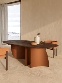 Indigo oval table in the Moka oak wood top version and Leather-painted metal legs