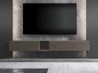 TV wall paired with a suspended base unit with a drop-down door and open compartment