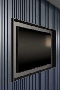 Plissè effect of the front panels in matt lacquer (Ocean finish) with TV compartment in metallic lacquer (Bronze finish)