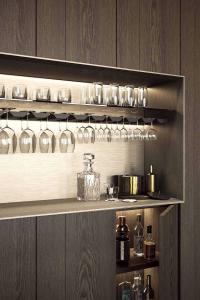 Bar compartment in metallic lacquer (the Champagne finish) with practical storage underneath