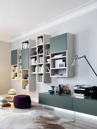 Side view of the suspended bookcase with matte lacquered doors and backs coordinated with the TV stand base units
