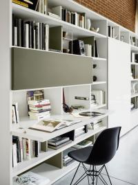 Way 23 wall system with white lacquered glass sliding door and foldaway desk