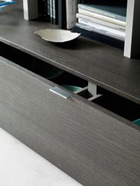Detail of the discreet handle on the floor-standing storage bases