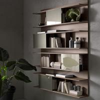 Pair of wall mounted bookcases with sliding doors