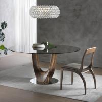 Tilda curved design wooden chair under a design wooden table