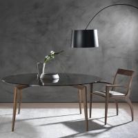 Tilda curved design wooden chair in combination with a top glass dining table