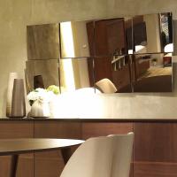 Chic modular mirror with bronze finish for a cosy and warm atmosphere