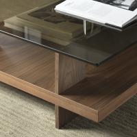 Detail of wooden coffee table with bronze glass and Canaletto walnut plated aluminium vertical details 