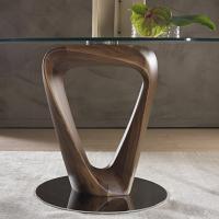 Detail of the twisted triangular wooden structure and of the polished chrome-plated metal