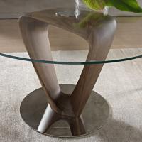 Detail of the twisted triangular wooden structure and of the polished chrome-plated metal