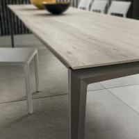 Detail of the design shaped leg and of the HPL melamine 670 arctic oak